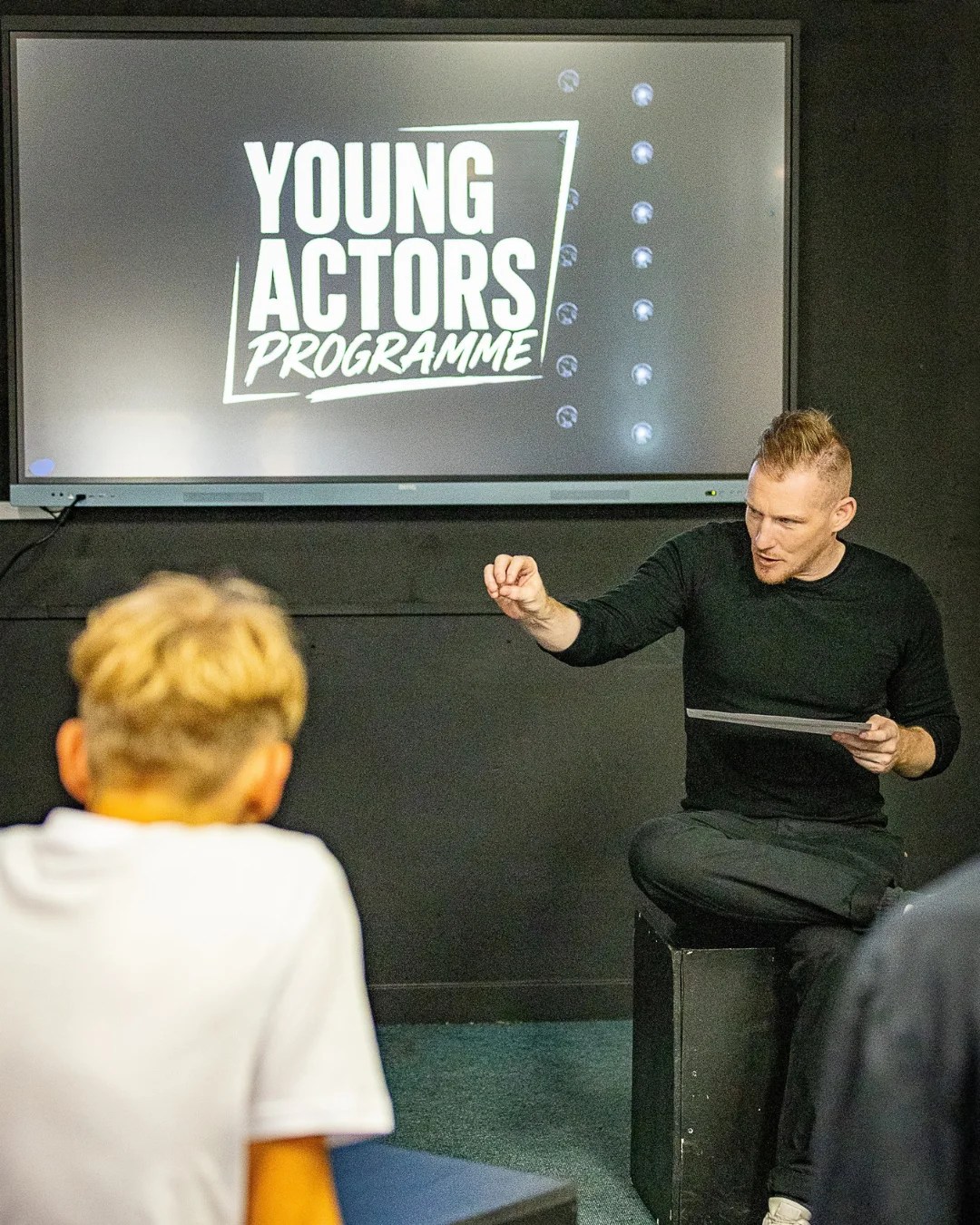 Young performers at work in an acting class